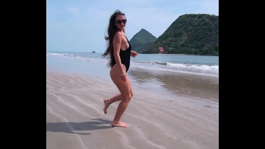 Black bikini and passionate flashing on the beach